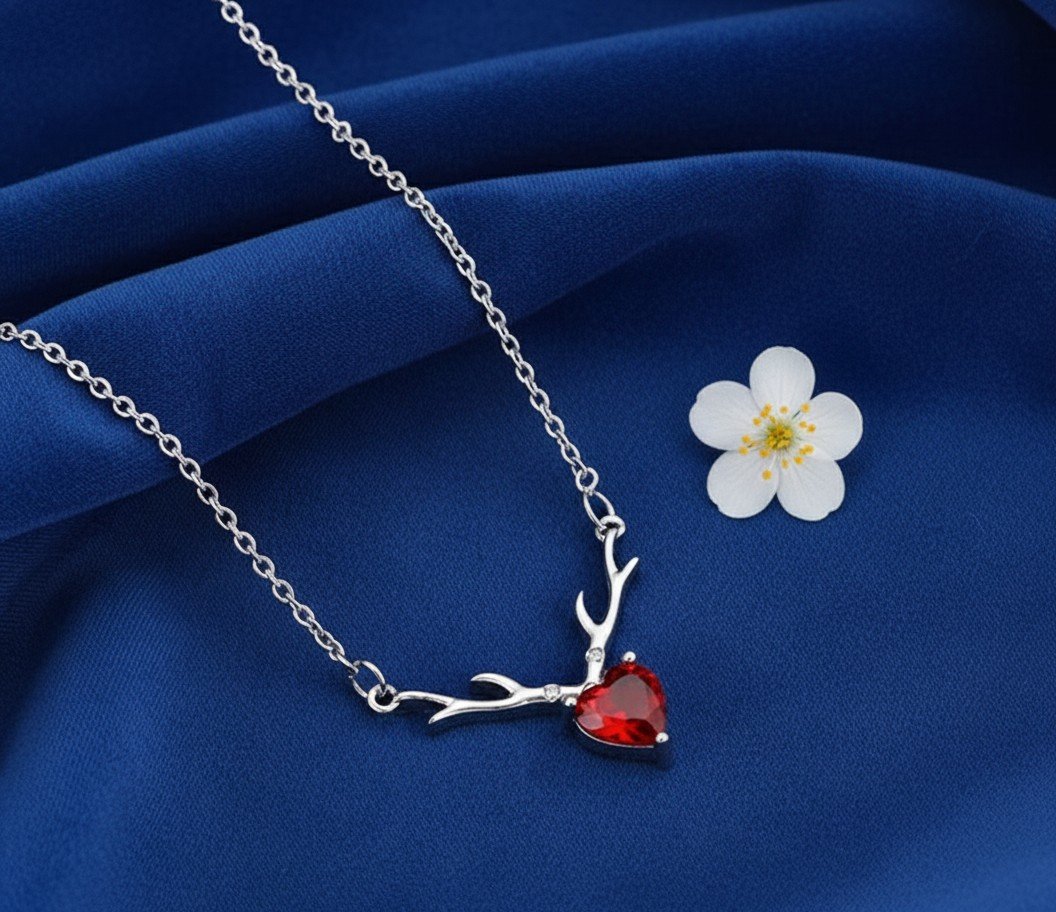 Elegant Silver Antler Necklace with Red Heart Crystal